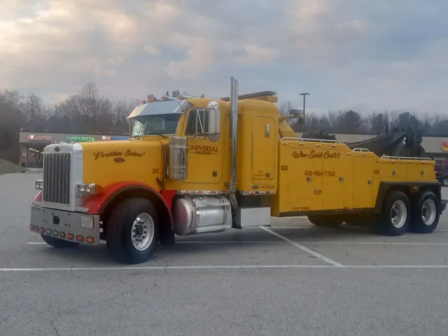 Universal Towing professional yellow tow truck Baltimore MD fleet vehicle